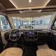 Intérieur d'un camping-car Fiat avec tableau de bord moderne et sièges en cuir beige